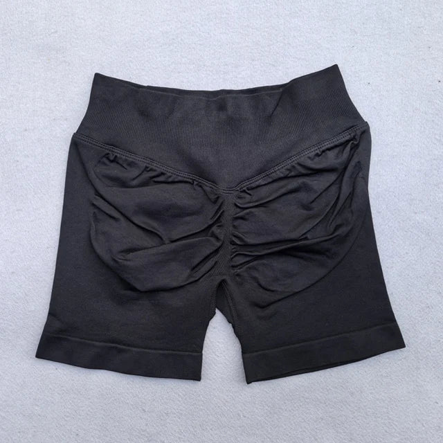 Conjunto Deportivo de 2 Piezas para Mujer
Top ajustable + shorts deportivos sin costuras